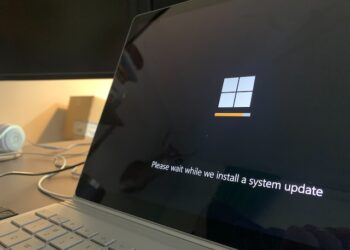 A black lock screen of Windows 11 updating